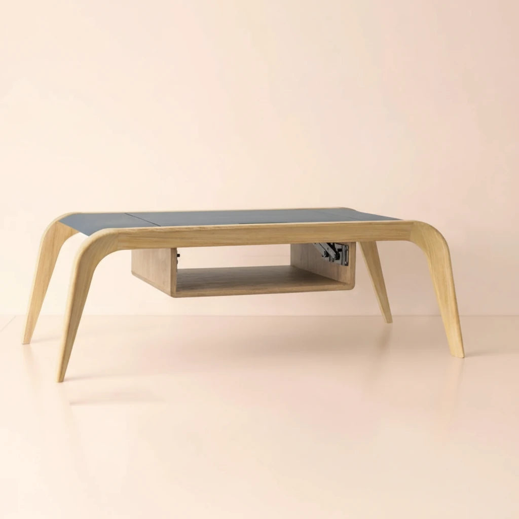 A luxury extendable oak coffee table with a dark blue top and a light pink background, professionally lit for e-commerce.