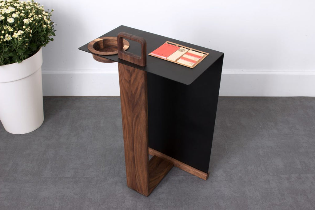 Luxury walnut side table with matte black top and wooden bowl inset near handle